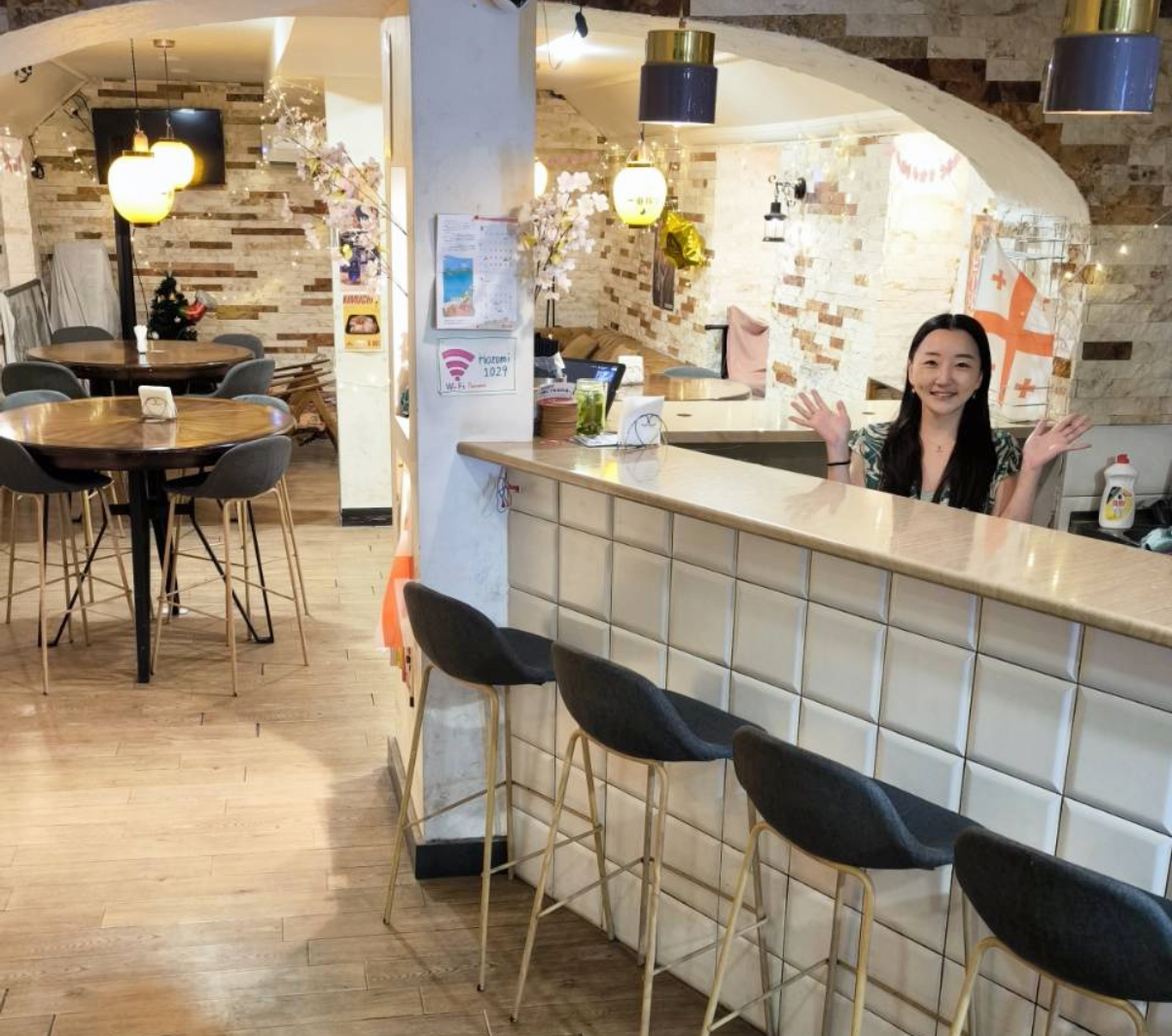 Nozomi Bar counter in Tbilisi with Japanese Alchohol bottles and small plates